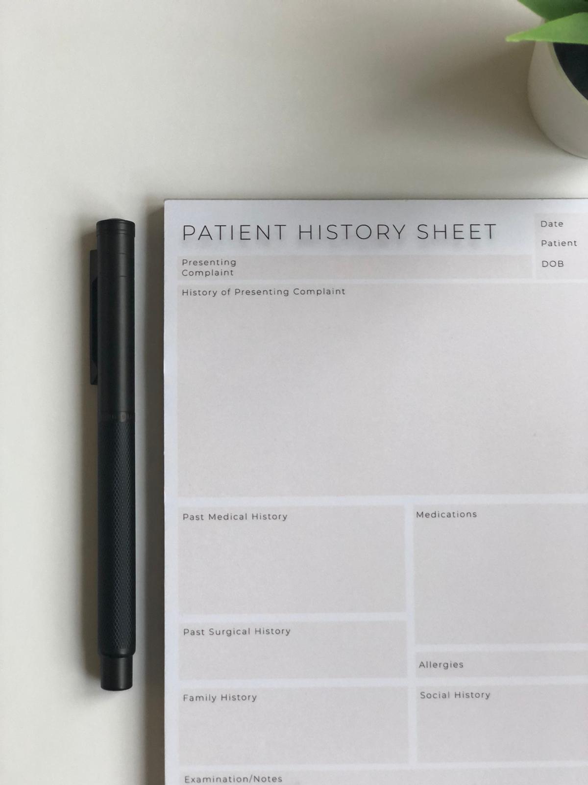 Close up of patient history template sections on an A5 notepad